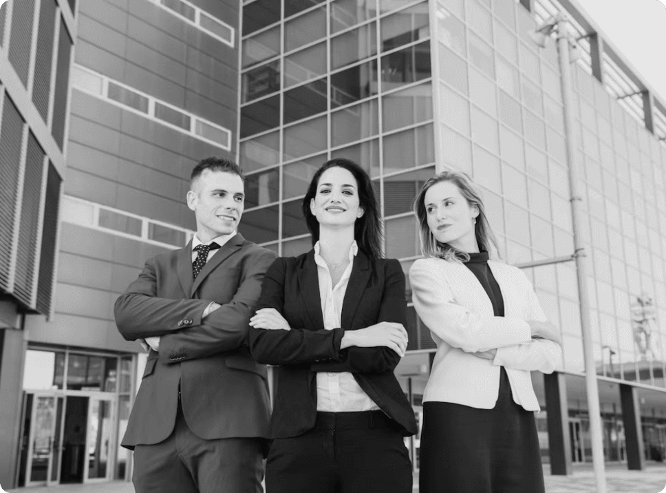 Professional bankers standing in front of modern office building